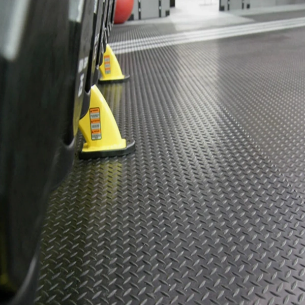 Close-up of black diamond plate rubber flooring