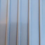 Close-up of slate grey garage flooring with a parallel ribbed texture.