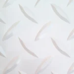 Close-up of white diamond tread garage flooring.