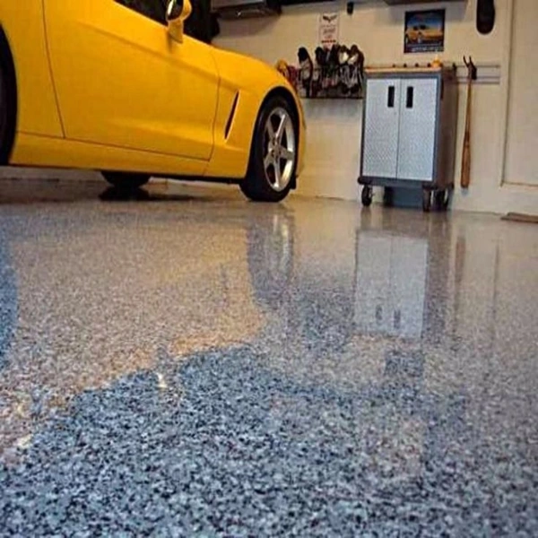 Glossy blue flake epoxy garage floor with yellow car