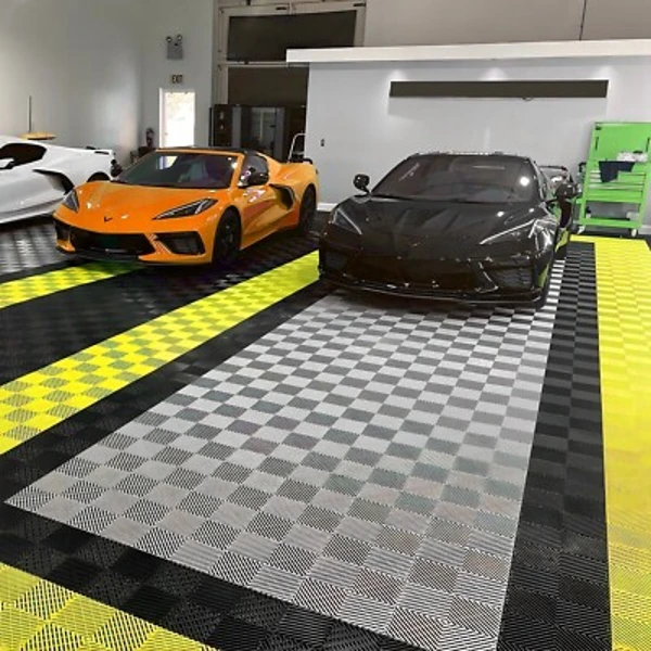 Modern garage with checkered black and yellow floor tiles