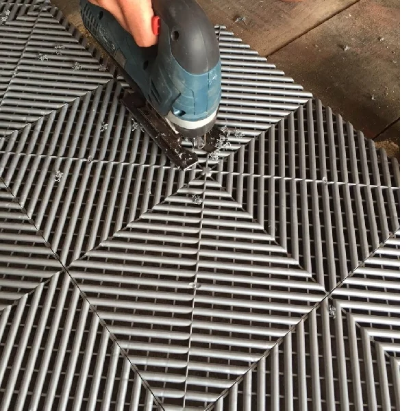 ribbed interlocking tile with triangular geometric pattern.