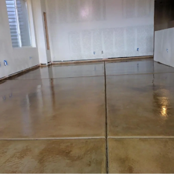 tan-colored sealed concrete garage floor with a highly reflective finish