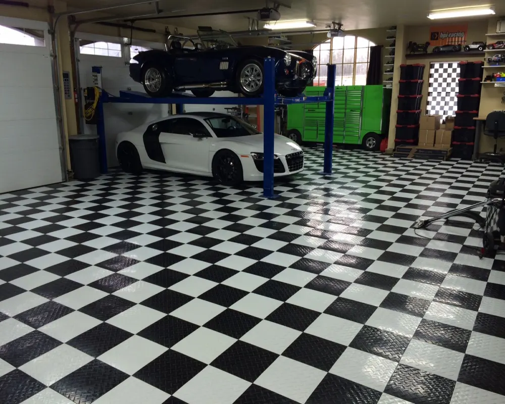 Black and white patterned garage tile flooring Dubai with high-end sports cars