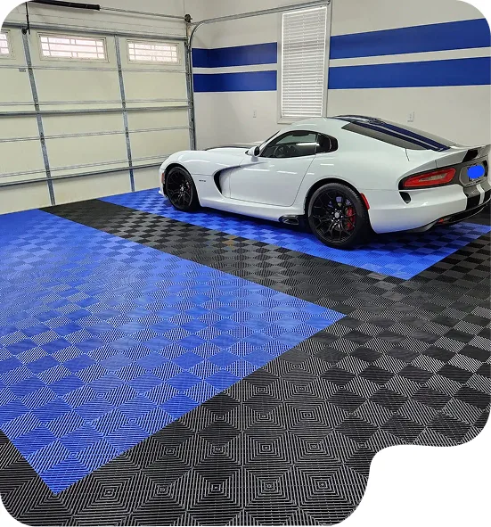 Blue and black pvc garage flooring with a breathable ribbed texture installed in a luxury home garage