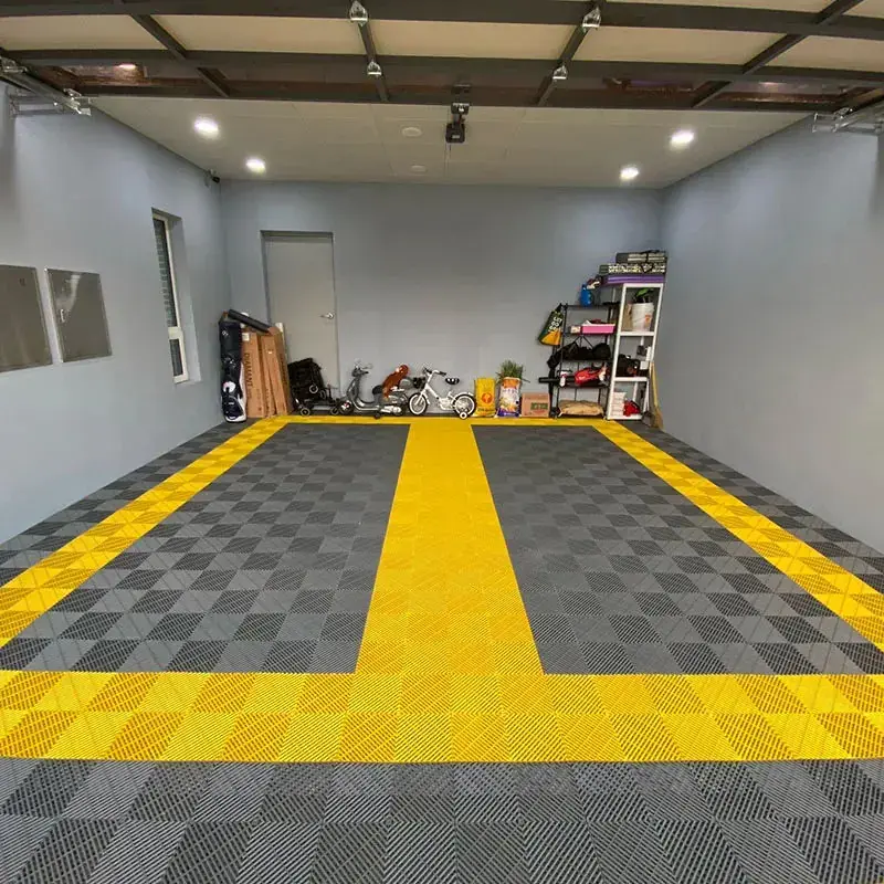 Gray and yellow checkered interlocking garage floor tiles