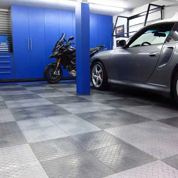 Grey and silver checkered pvc garage flooring with a diamond-plate texture in a modern luxury garage.