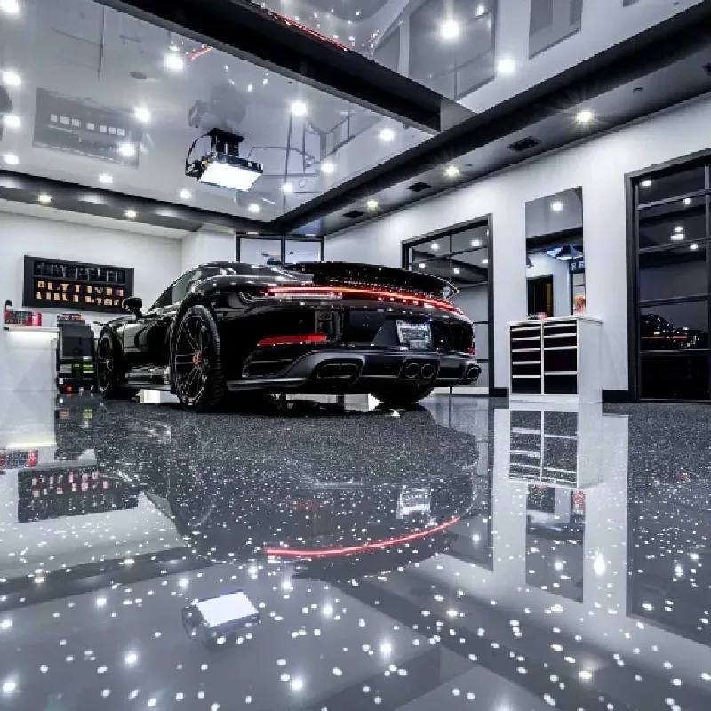 High-gloss black epoxy garage flooring with a reflective mirror finish in a luxury garage.