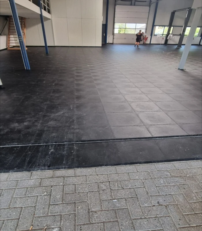 Industrial-grade black PVC flooring for commercial garages