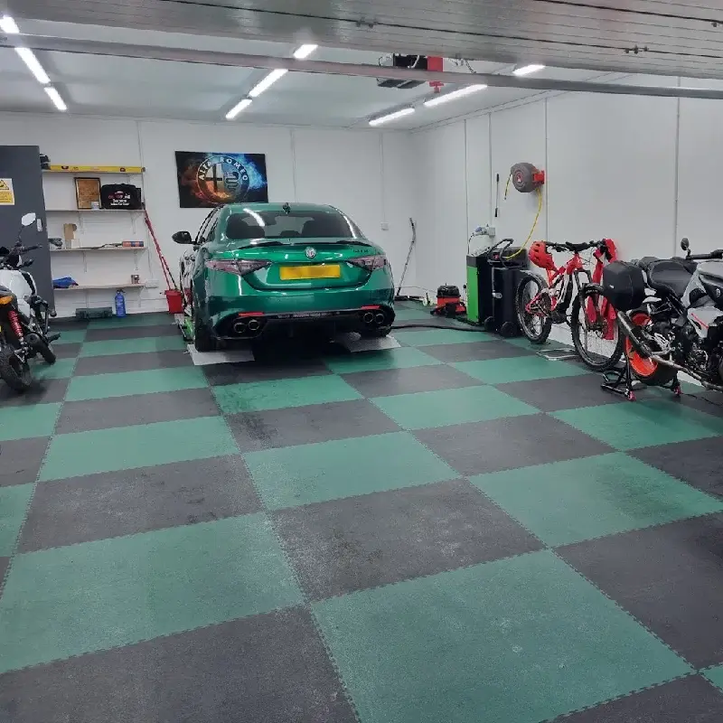 PVC garage floor tiles in a green and black checkerboard pattern