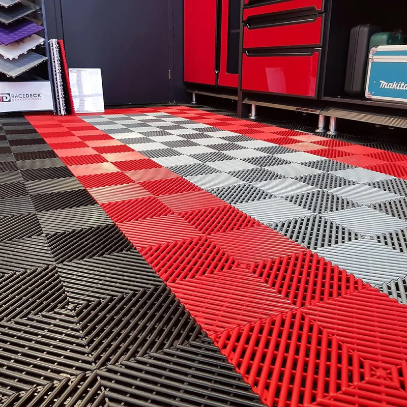 Slip-resistant rubber garage flooring featuring a flow-through vented tile pattern
