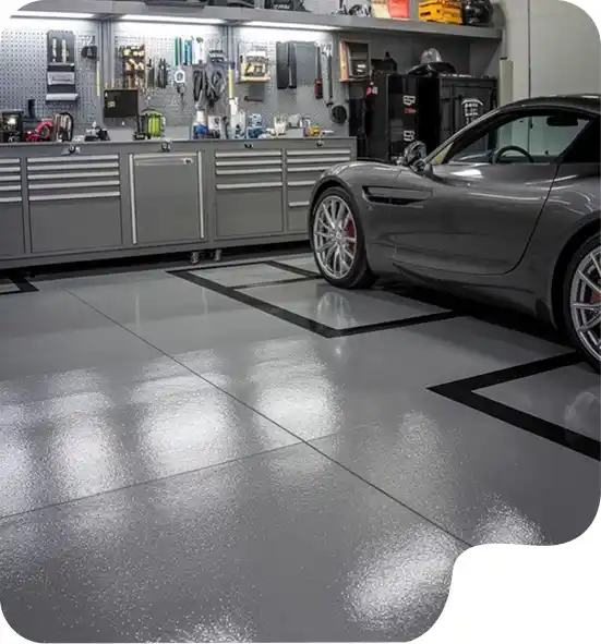 Modern garage tile flooring Dubai with a glossy light grey finish and professional tool storage system.