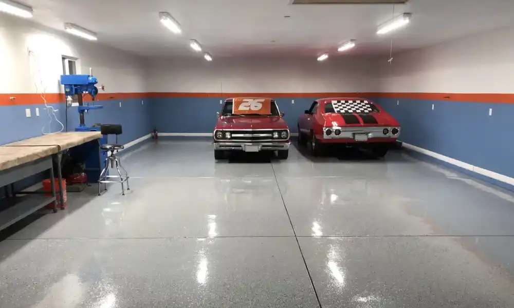 Grey flake epoxy garage flooring with a high-gloss protective finish